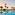 a pool with palm trees and a beach and a sunset