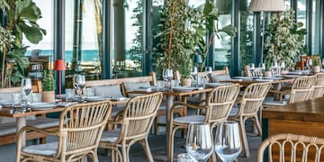 a restaurant with tables and chairs