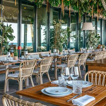 a restaurant with tables and chairs