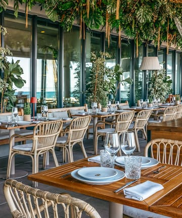 a restaurant with tables and chairs