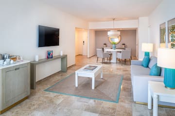 a living room with a tv and a table