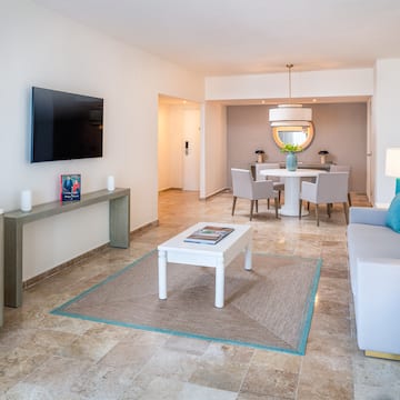 a living room with a tv and a table