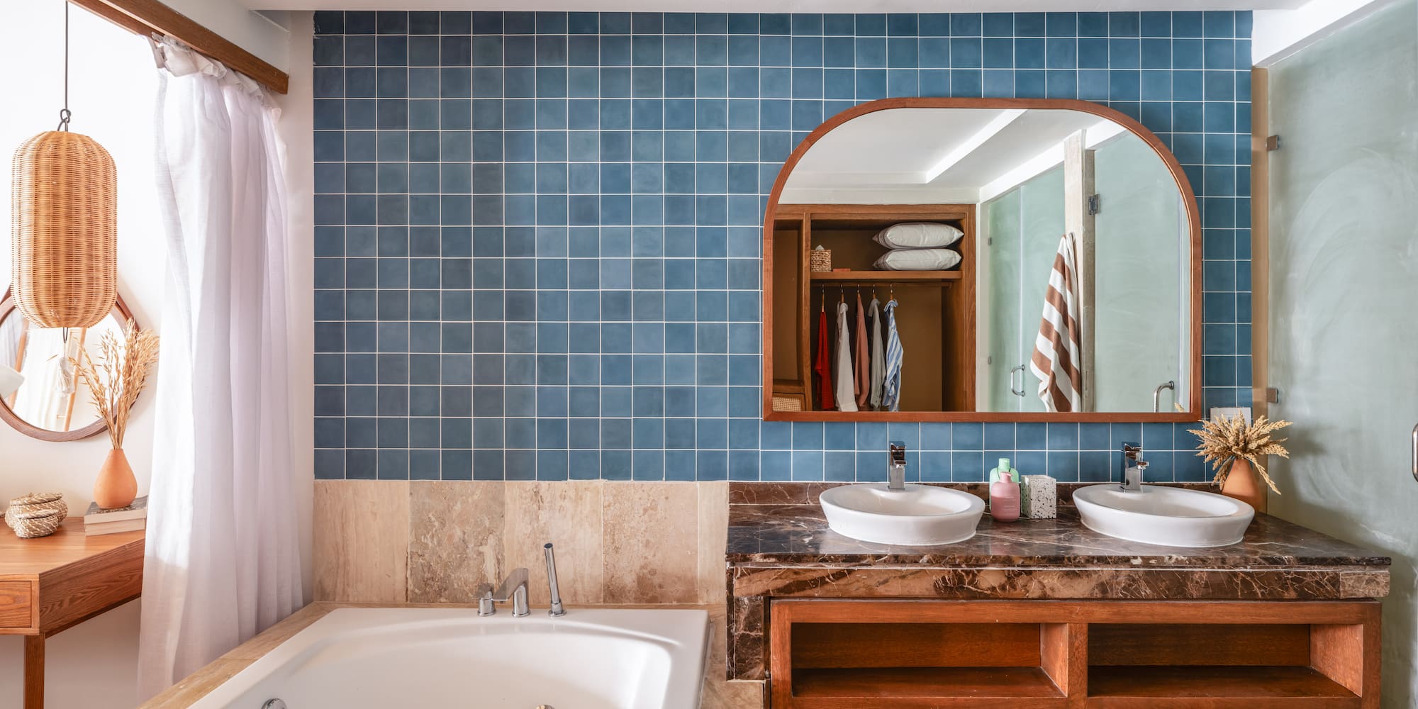 a bathroom with a bathtub and a mirror