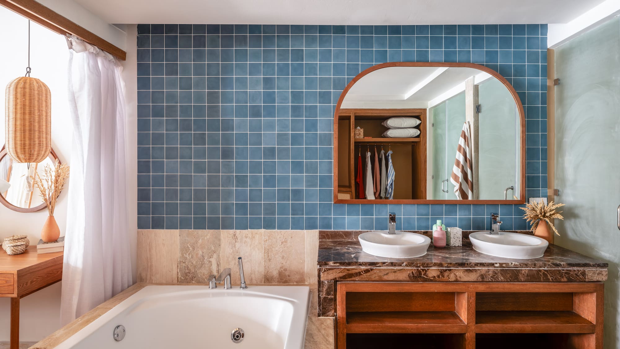 a bathroom with a bathtub and a mirror