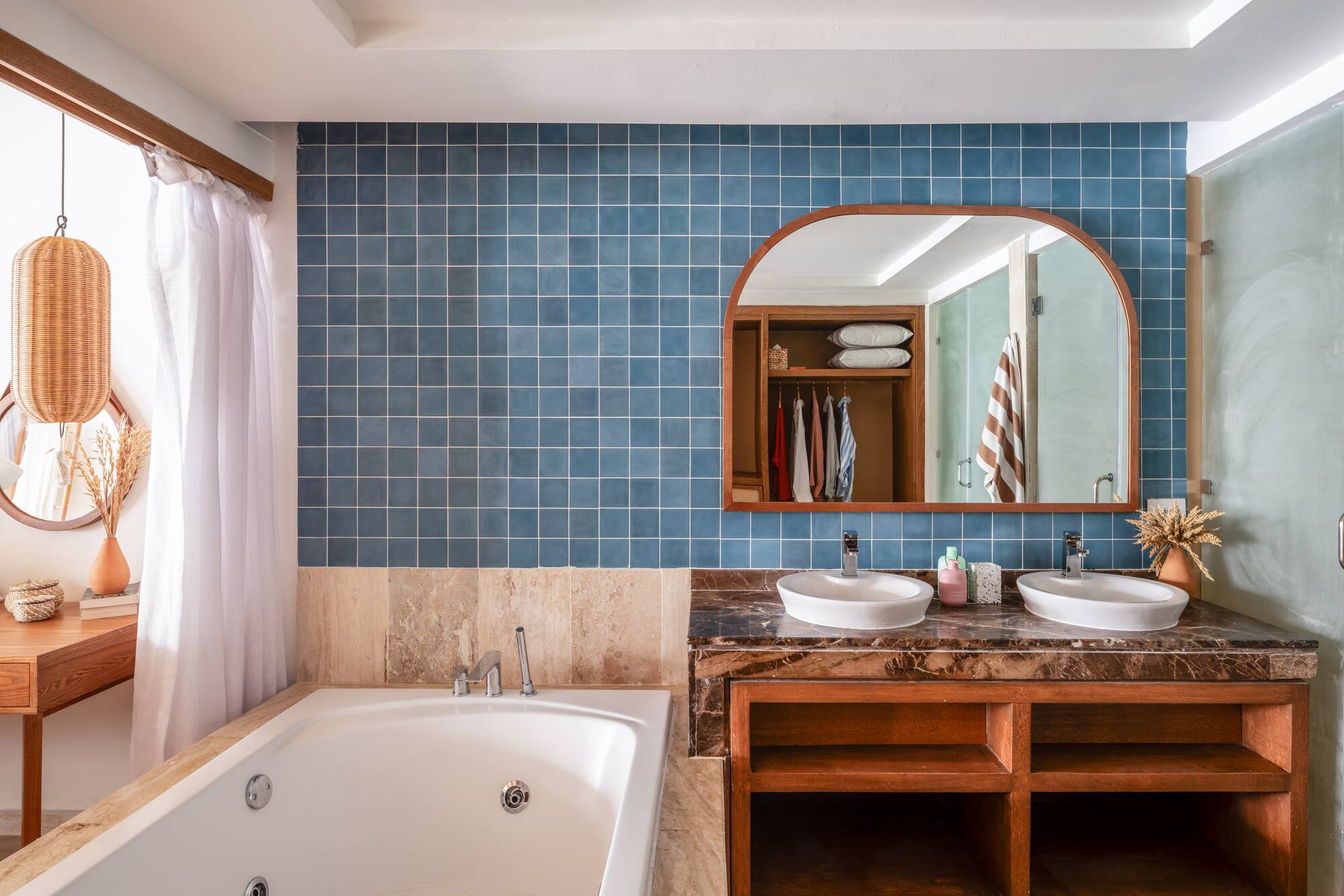 a bathroom with a bathtub and a mirror