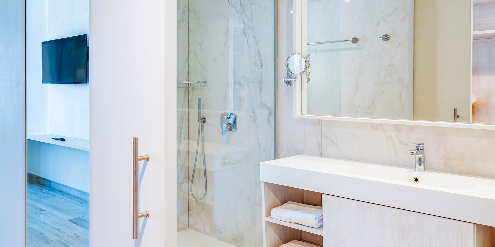 a bathroom with a shower and a mirror