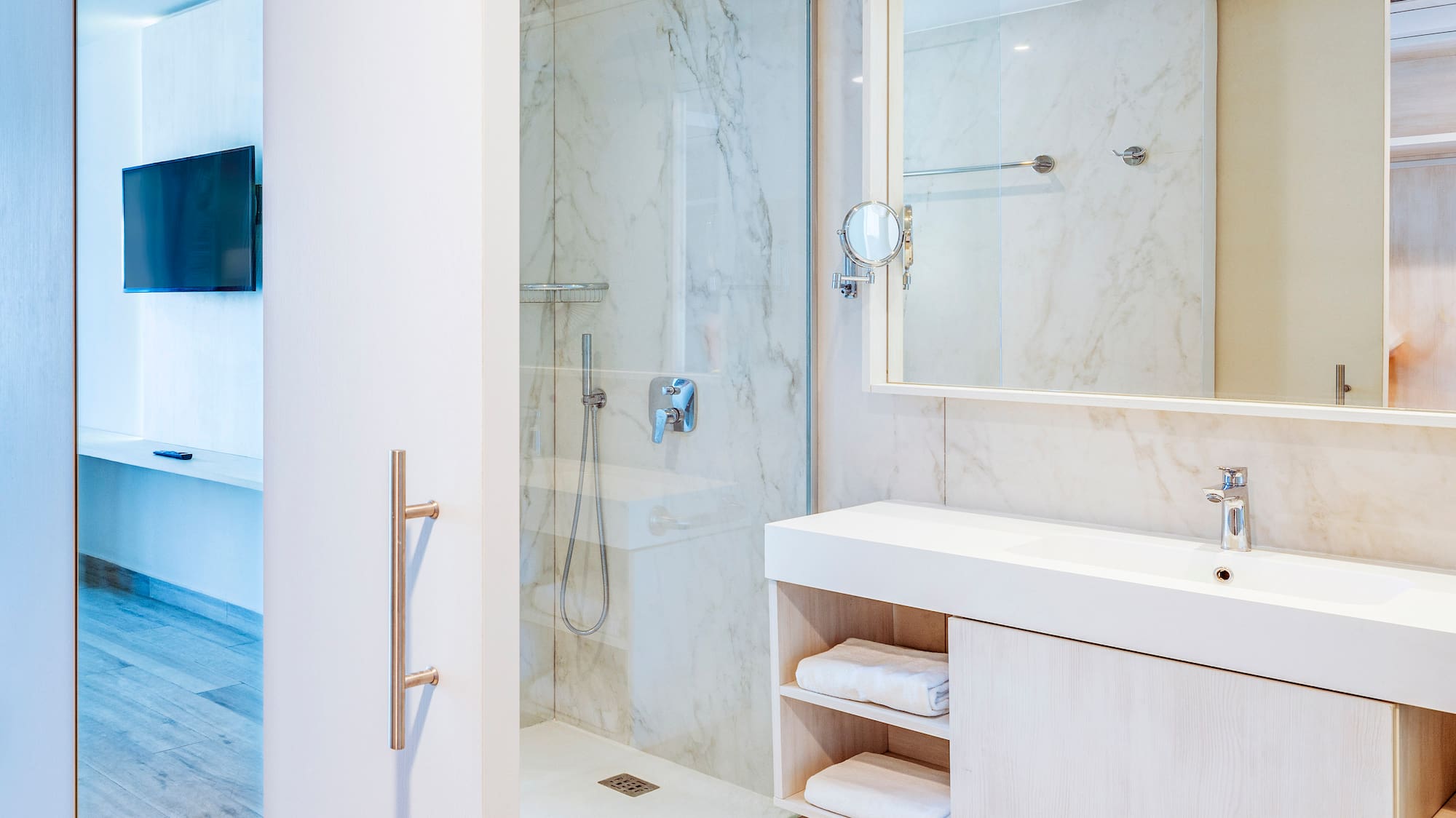 a bathroom with a shower and a mirror