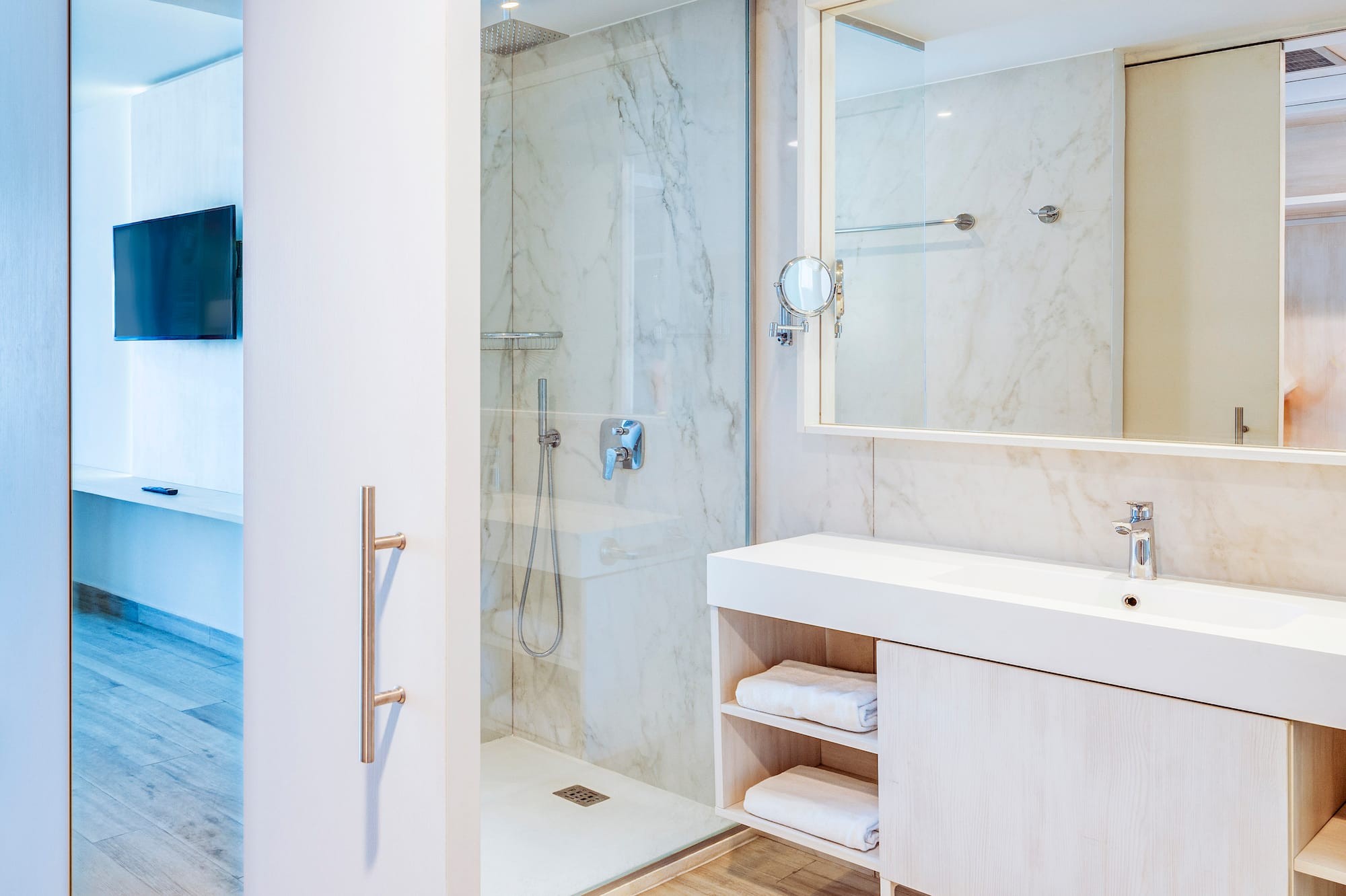 a bathroom with a shower and a mirror