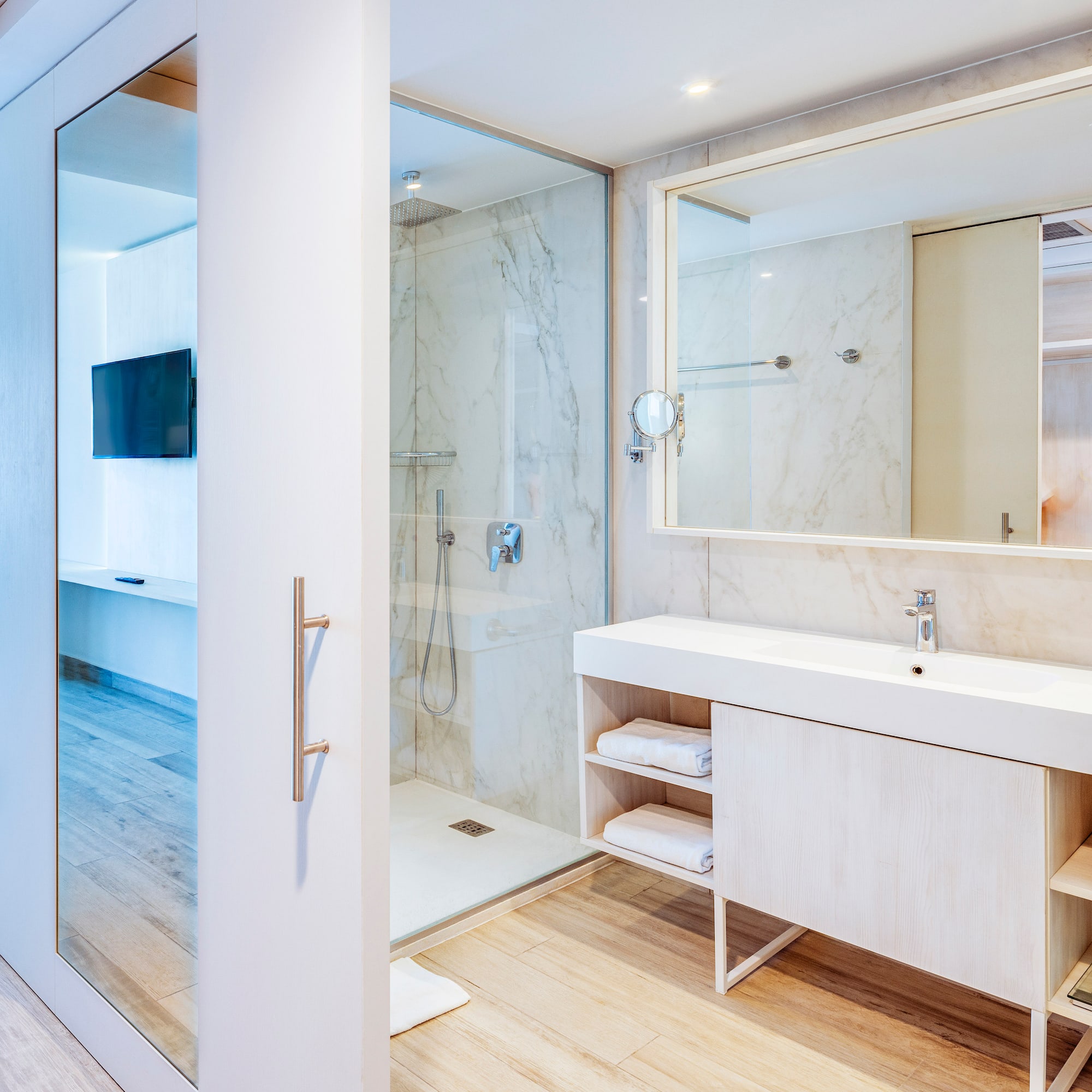 a bathroom with a shower and a mirror