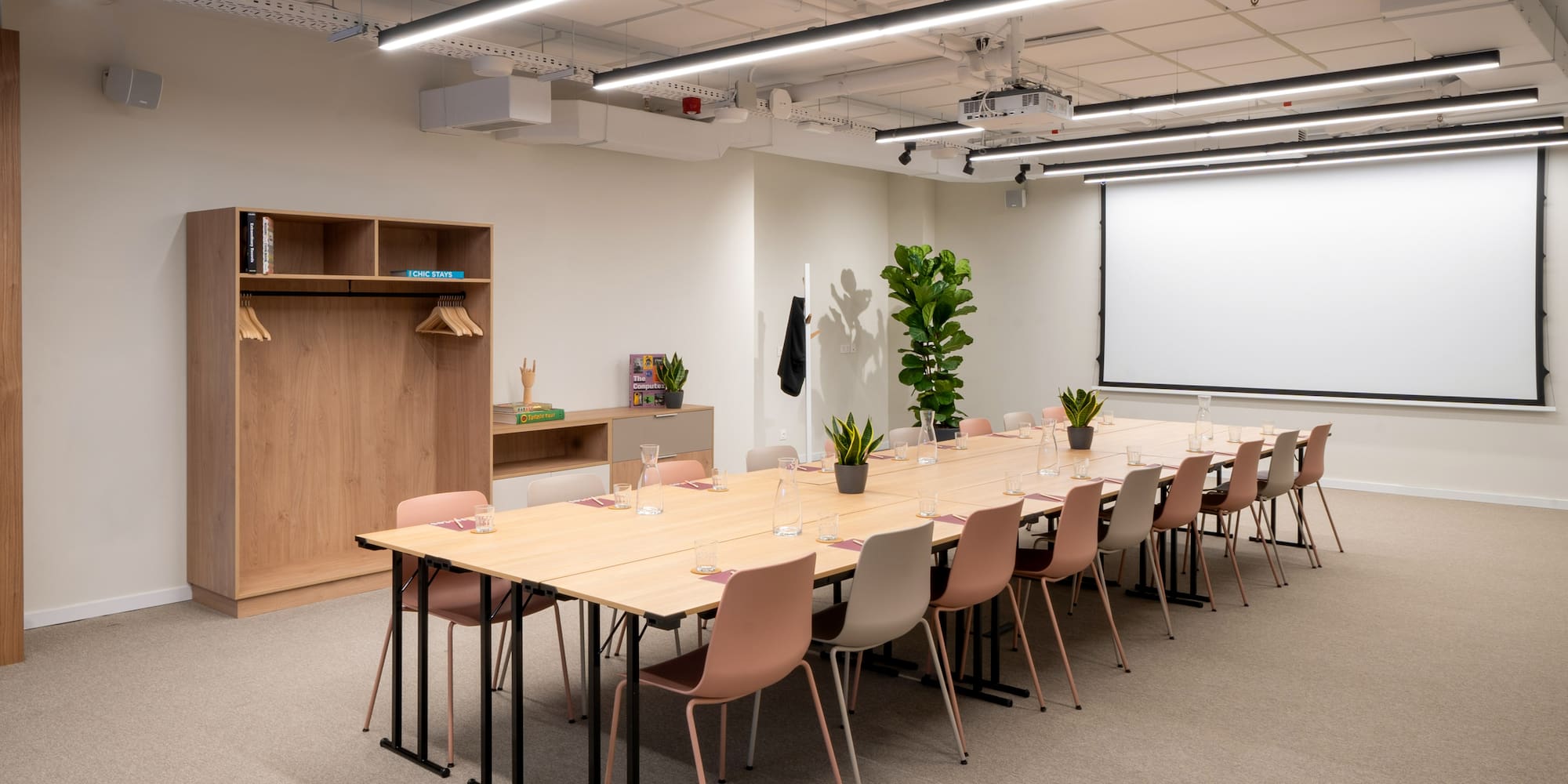 a room with a large table and chairs