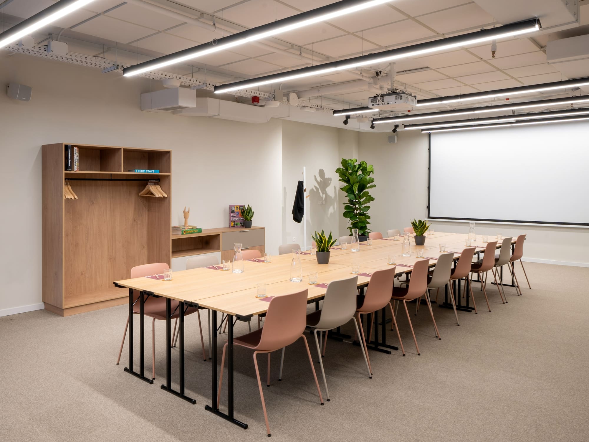 a room with a large table and chairs