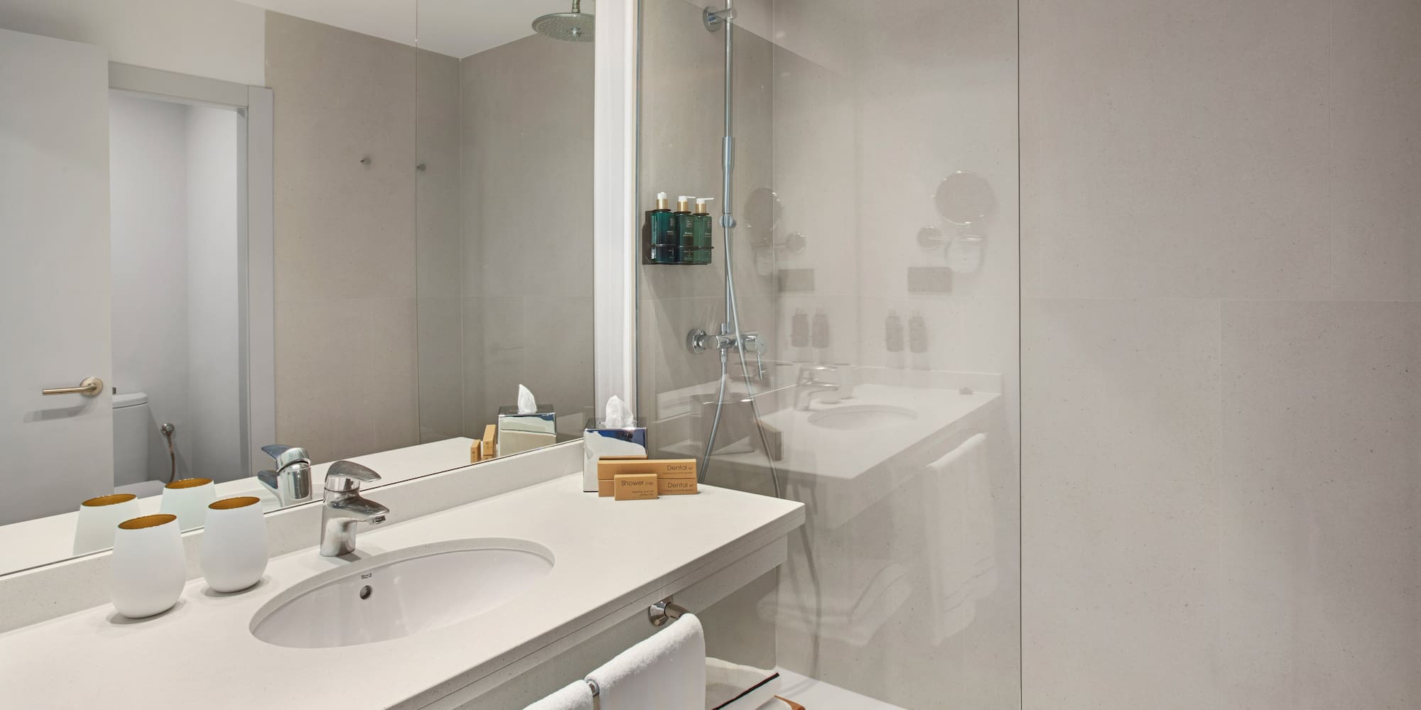 a bathroom with a shower and sink