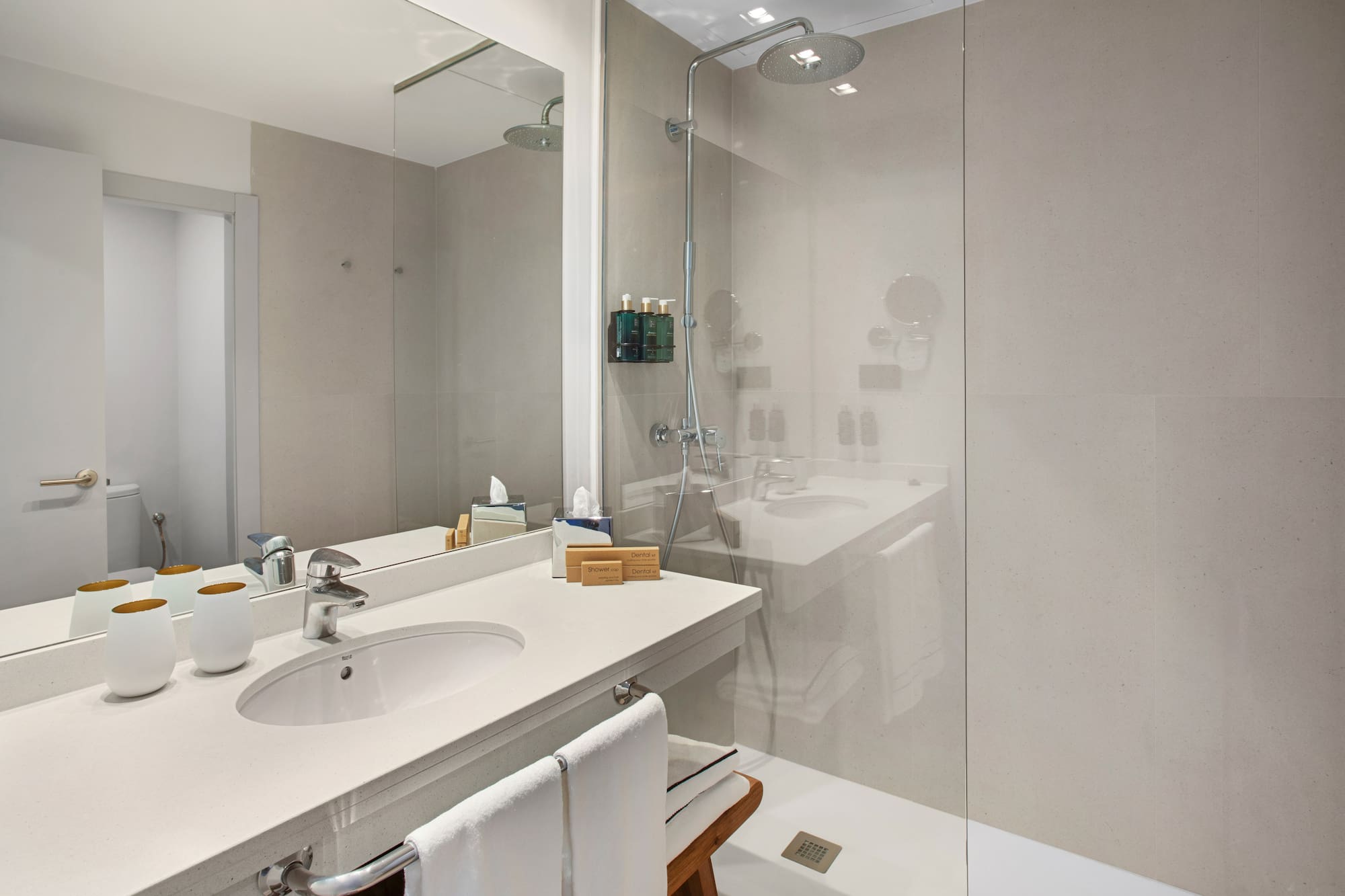 a bathroom with a shower and sink