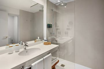 a bathroom with a shower and sink
