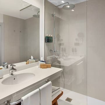 a bathroom with a shower and sink