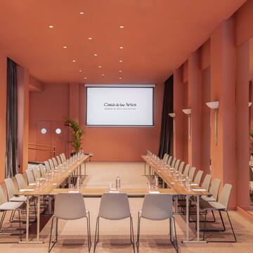 a room with a table and chairs