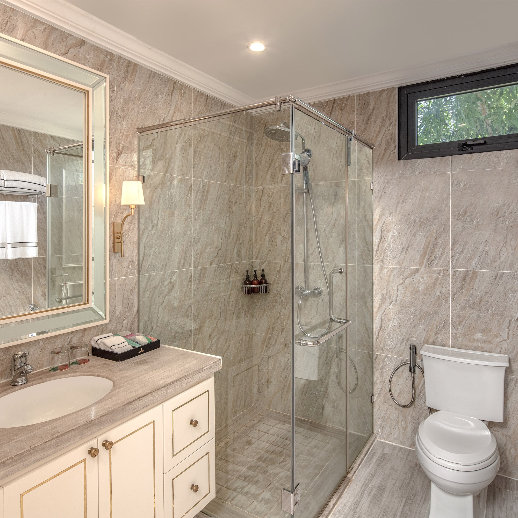 a bathroom with a glass shower and sink