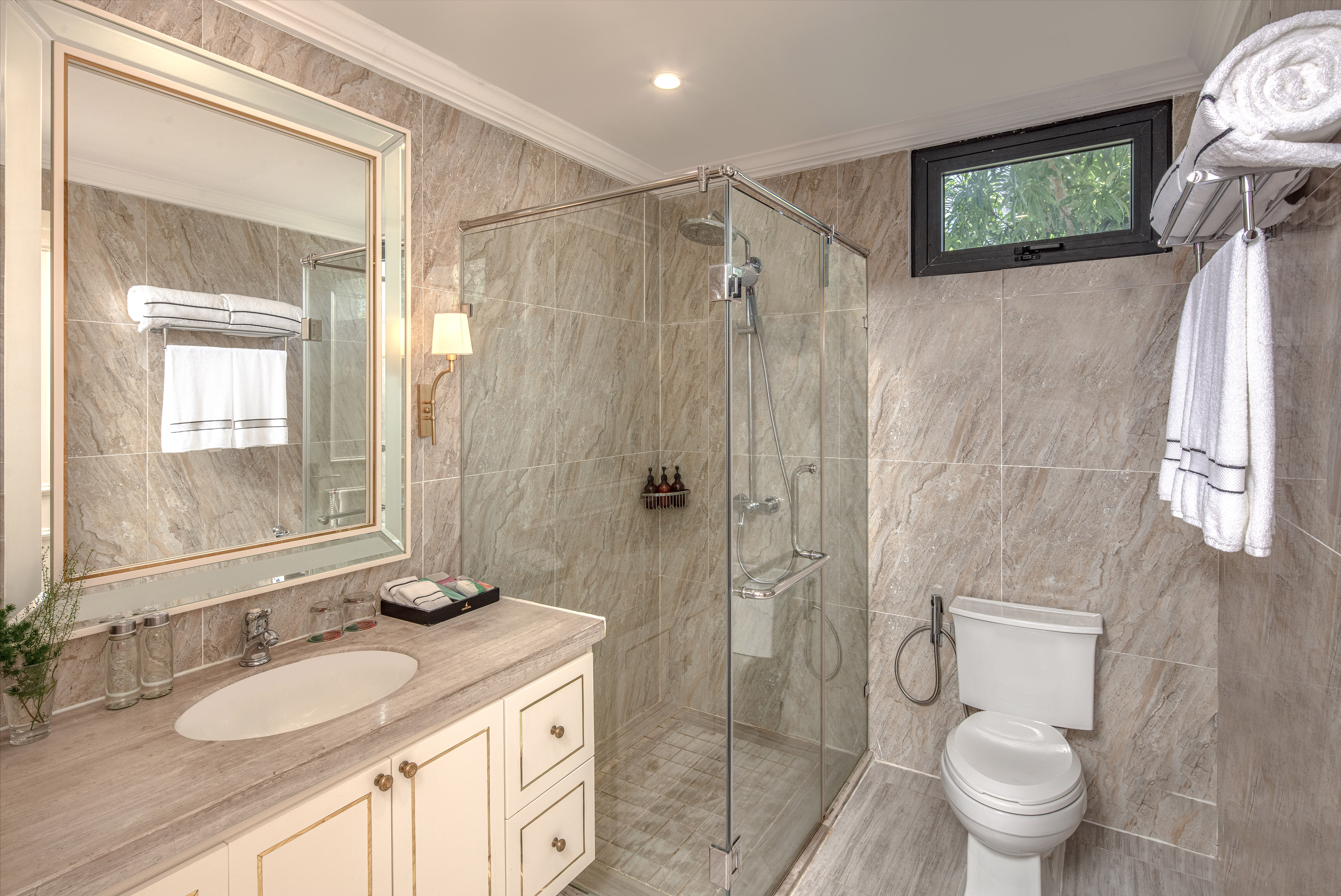 a bathroom with a glass shower and sink