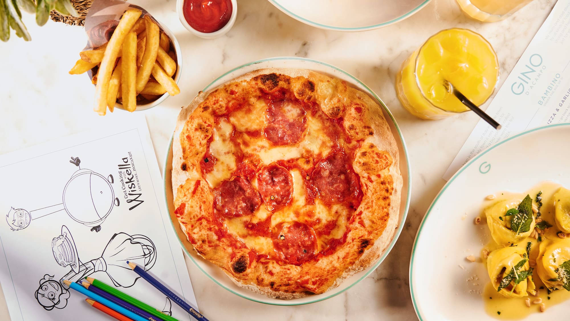 a pizza and some food on a table