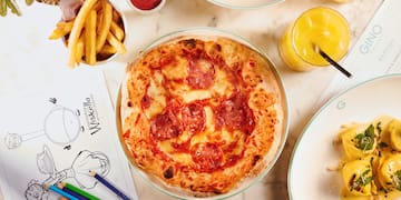 a pizza and some food on a table