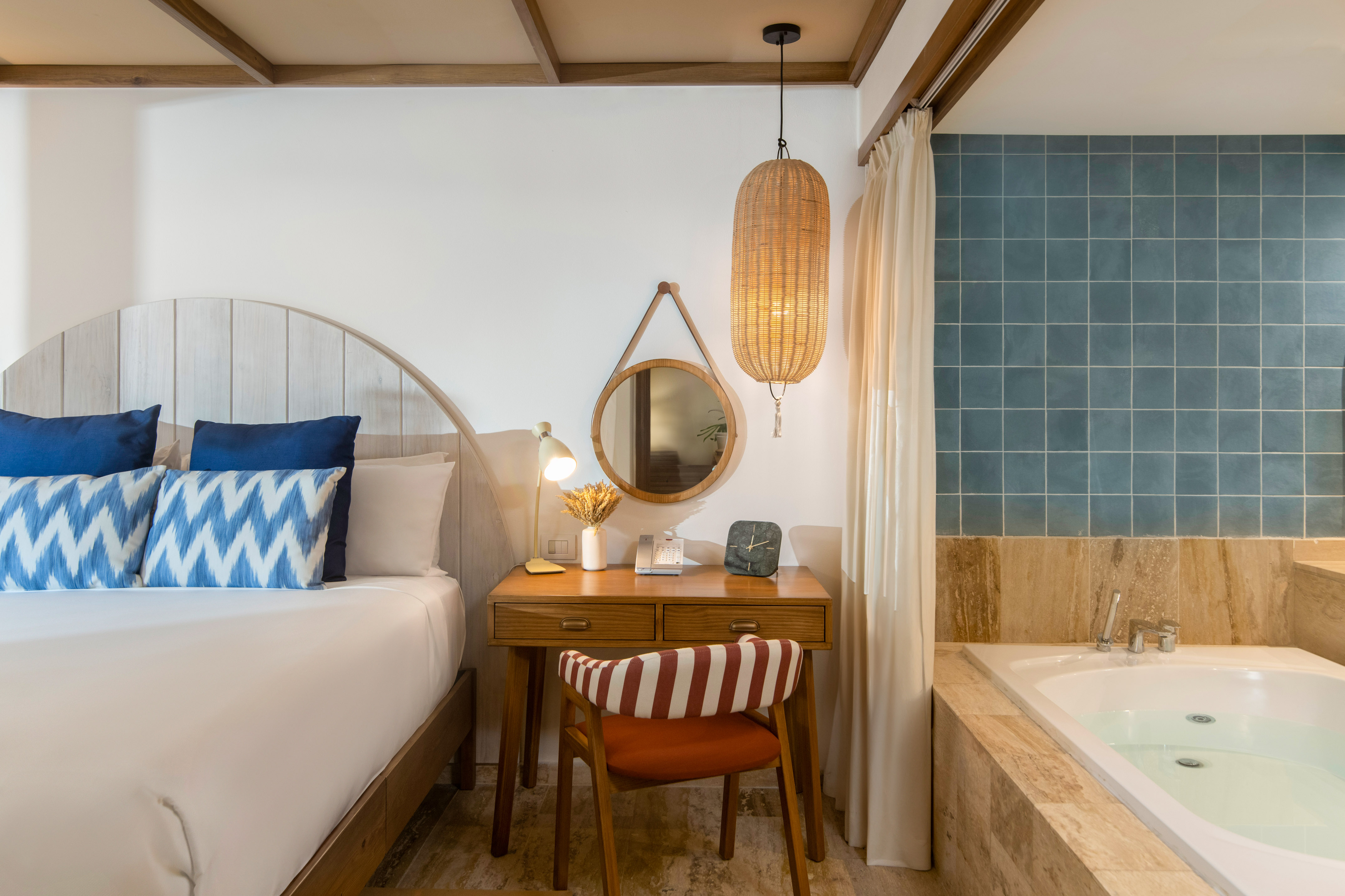 a room with a bed and a bathtub