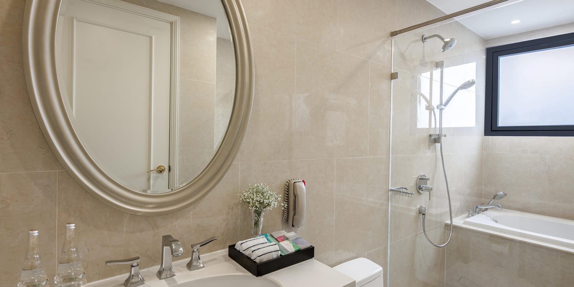 a bathroom with a mirror and a shower