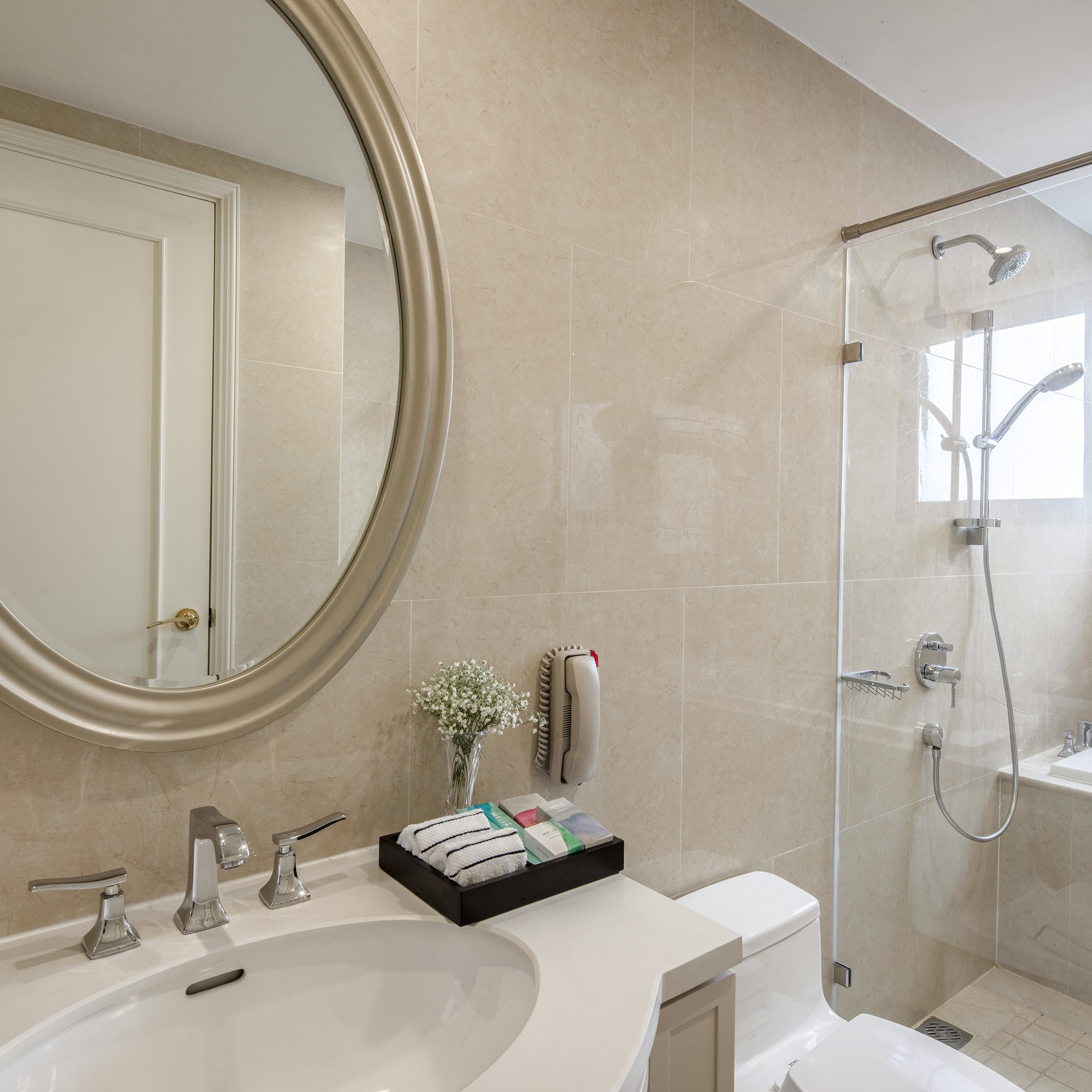 a bathroom with a mirror and a shower