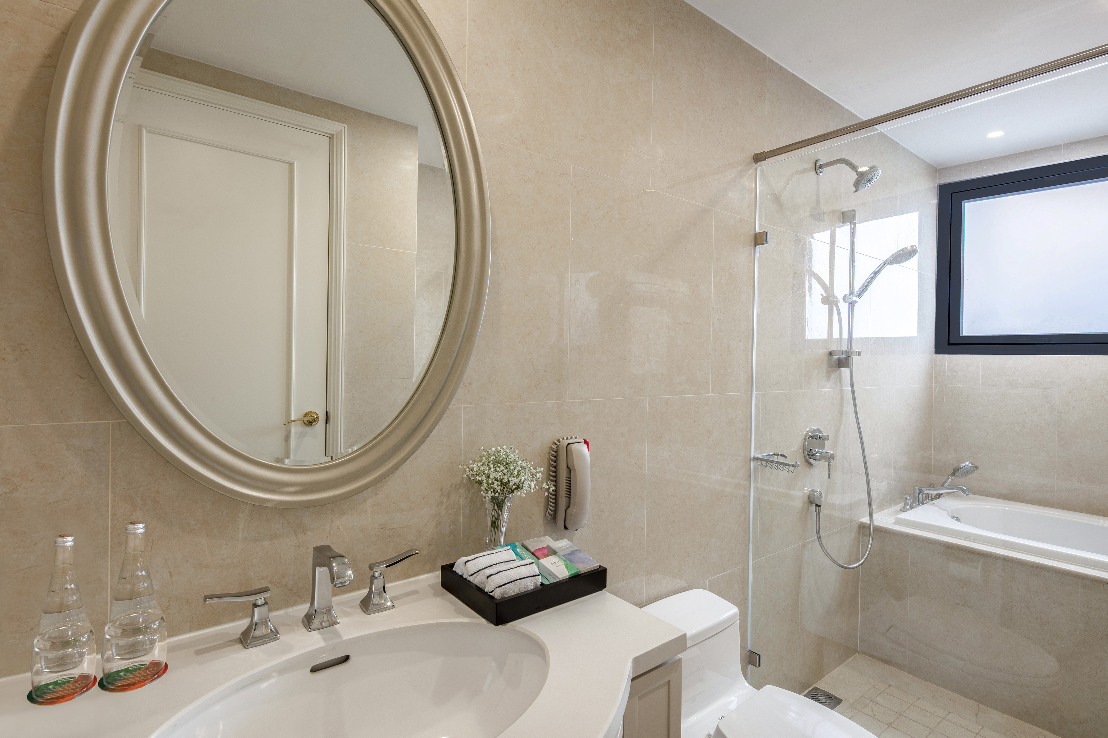 a bathroom with a mirror and a shower