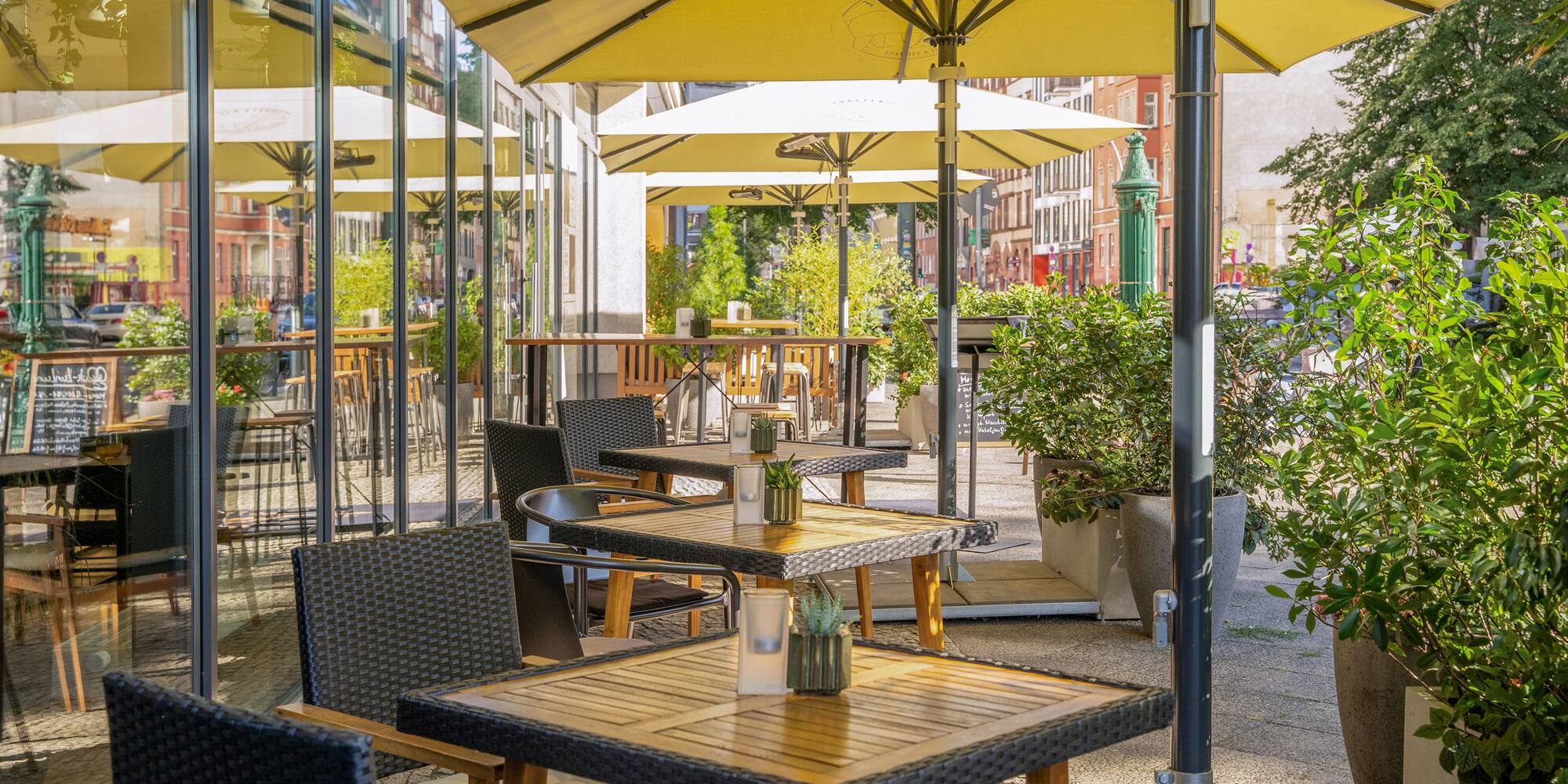 a tables and chairs under an umbrella