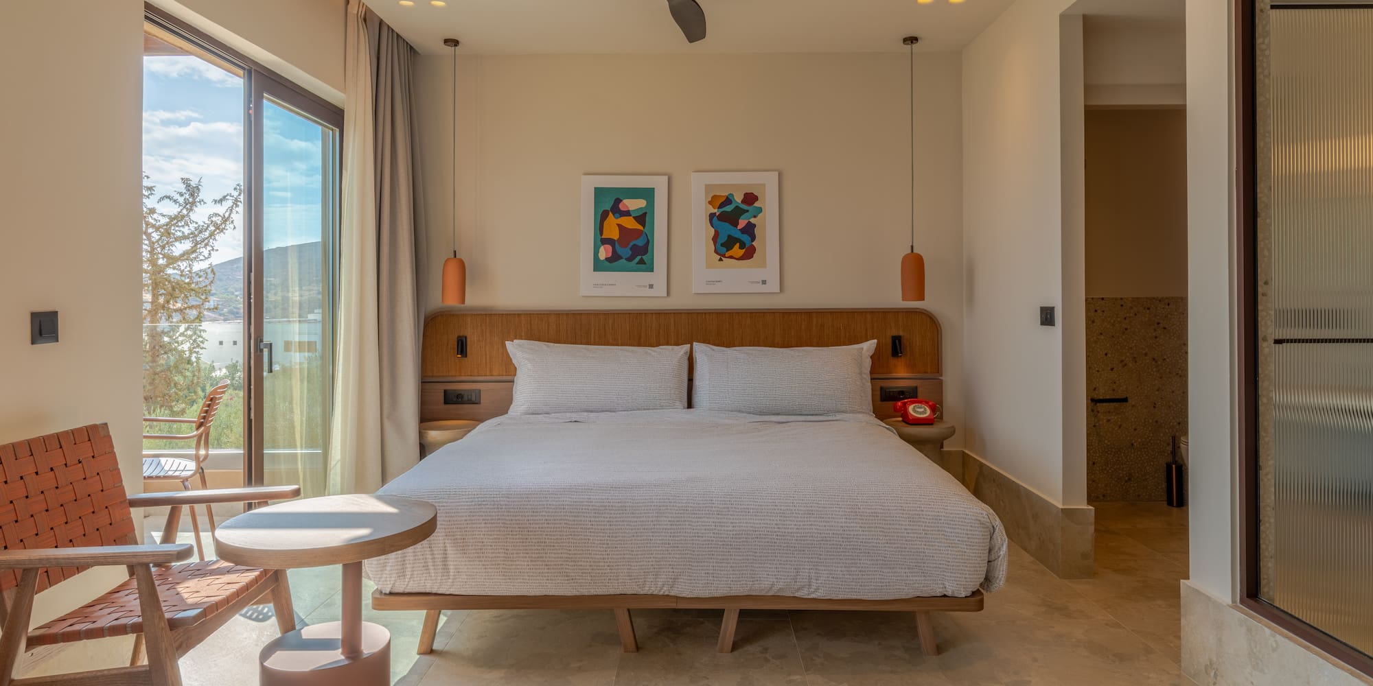 a bedroom with a bed and a ceiling fan