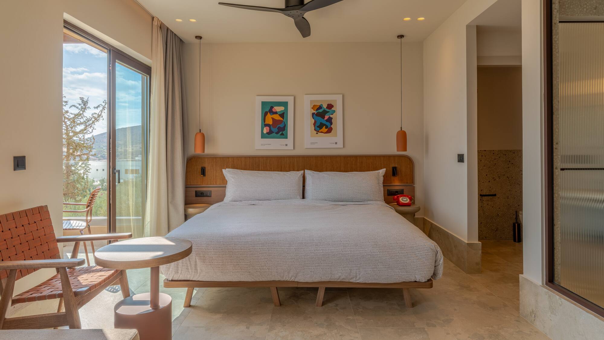 a bedroom with a bed and a ceiling fan