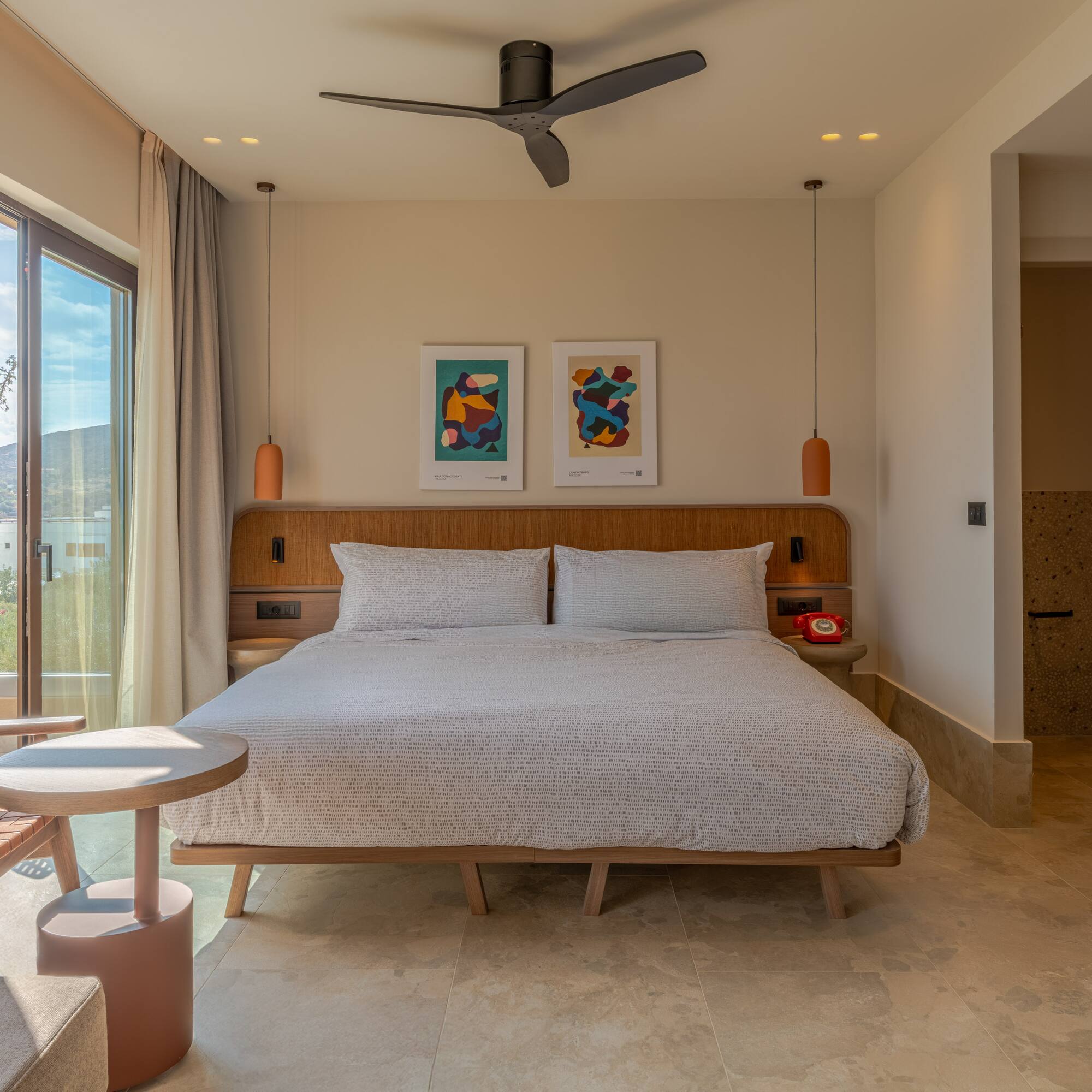 a bedroom with a bed and a ceiling fan