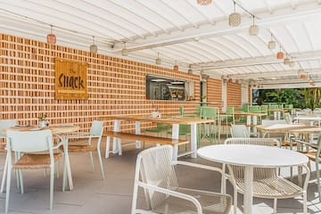 a restaurant with tables and chairs