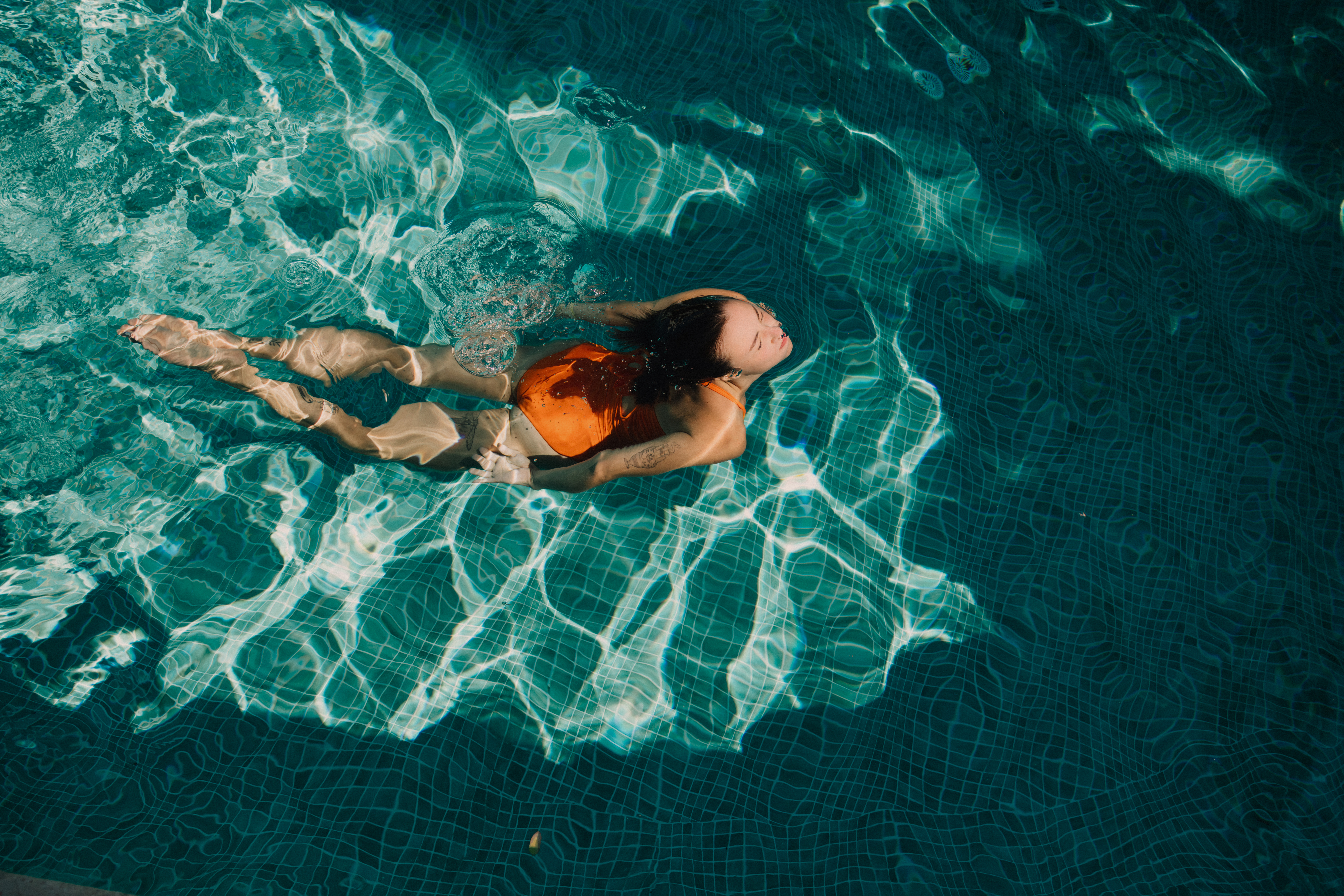 a woman in a swimsuit in a pool