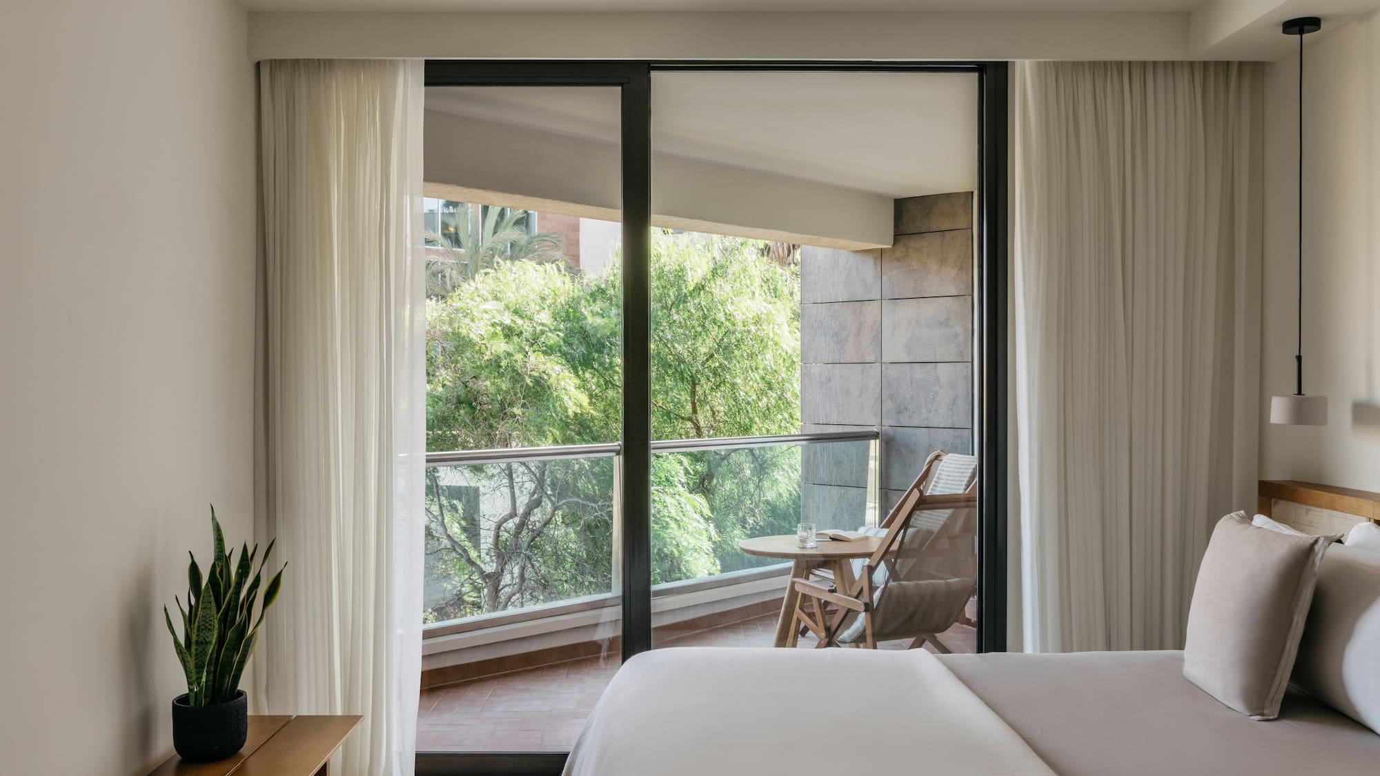 a bedroom with sliding glass doors