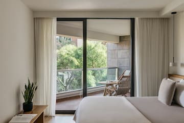 a bedroom with sliding glass doors