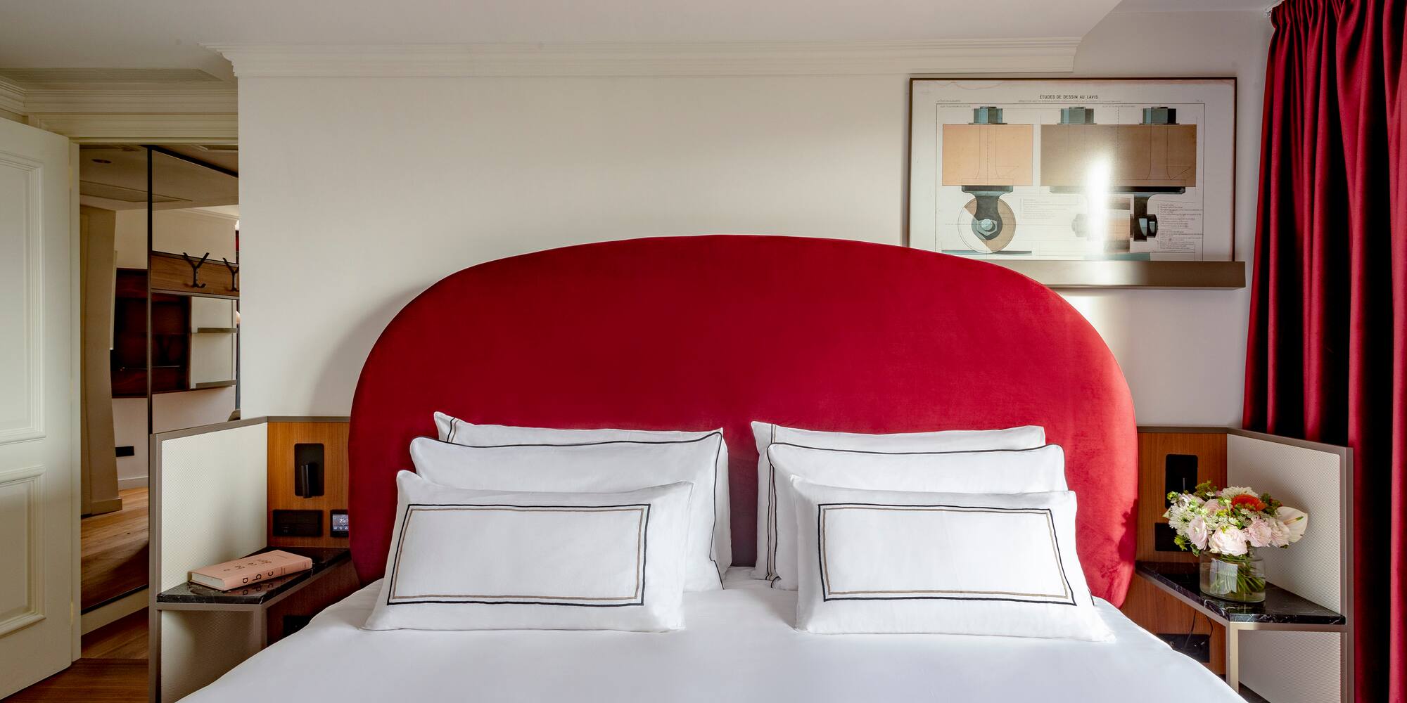 a bed with a red headboard