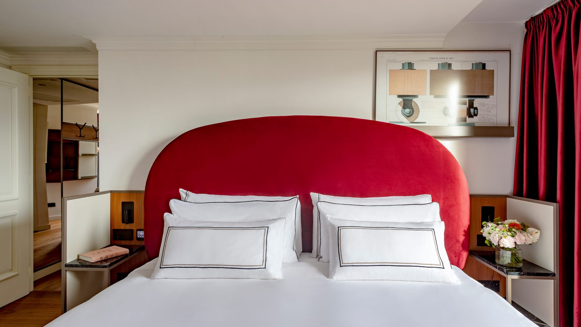 a bed with a red headboard