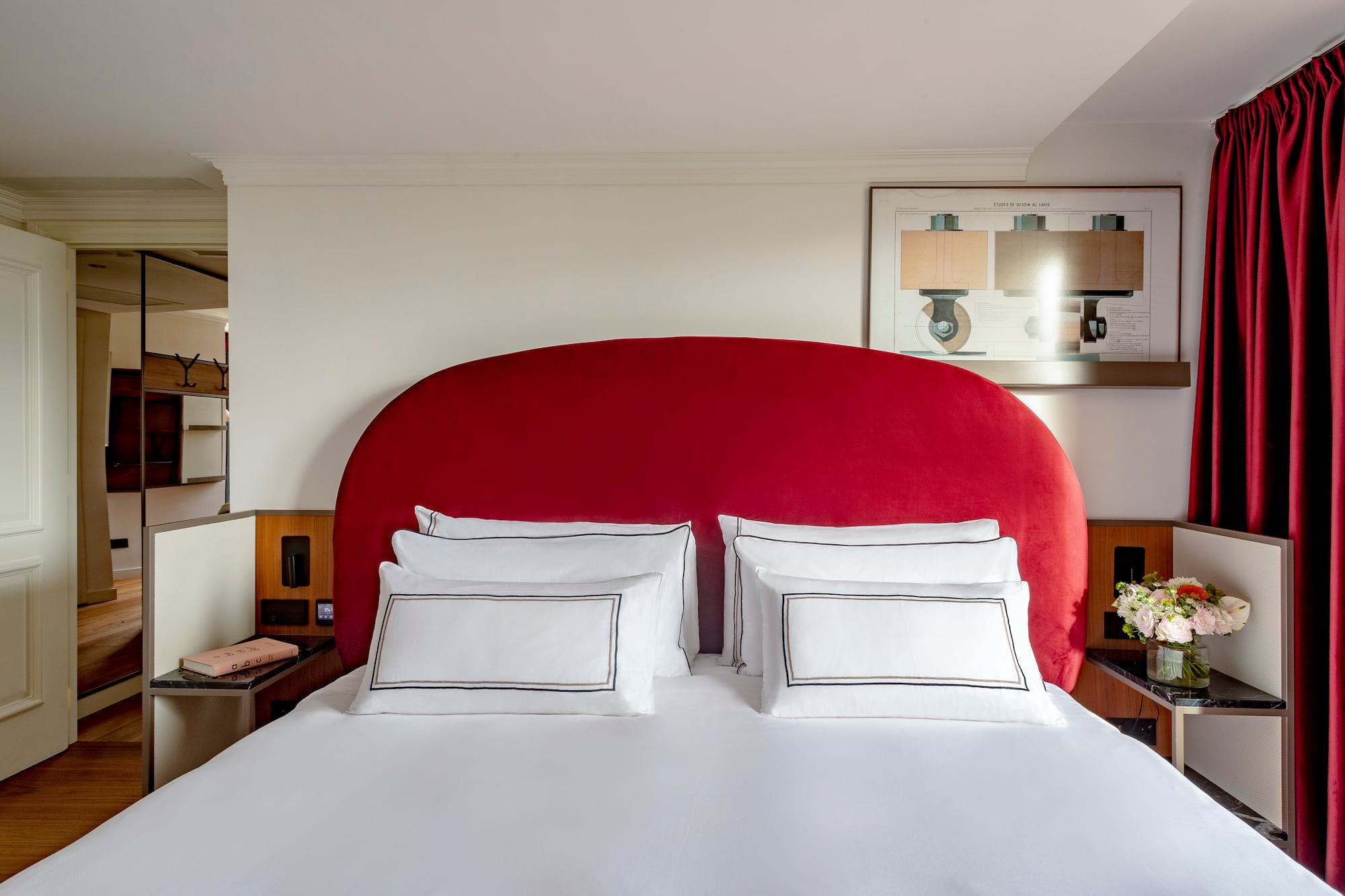 a bed with a red headboard