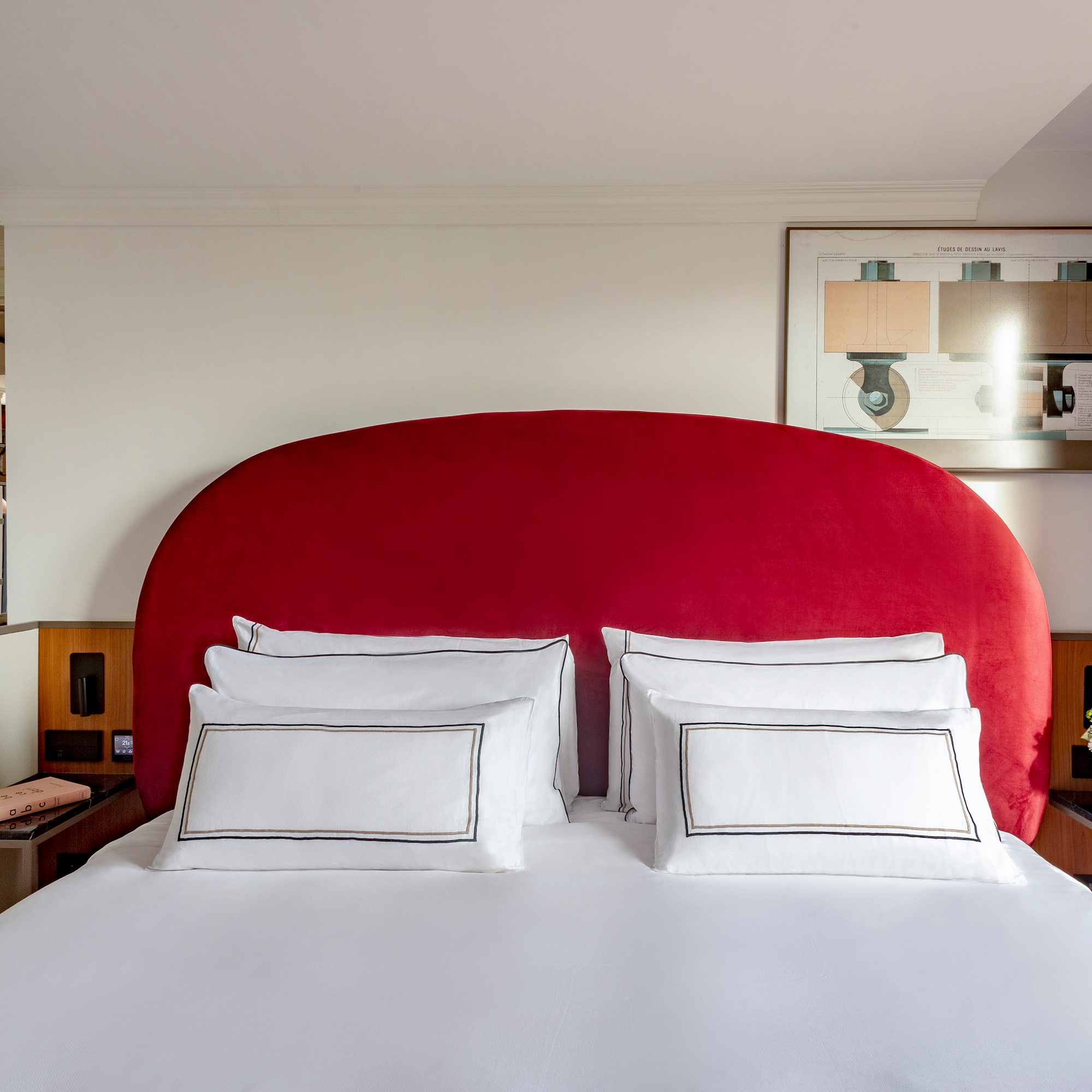 a bed with a red headboard