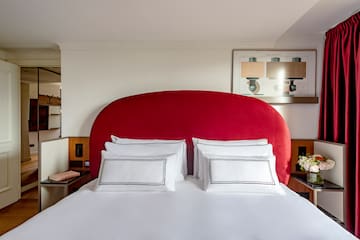 a bed with a red headboard