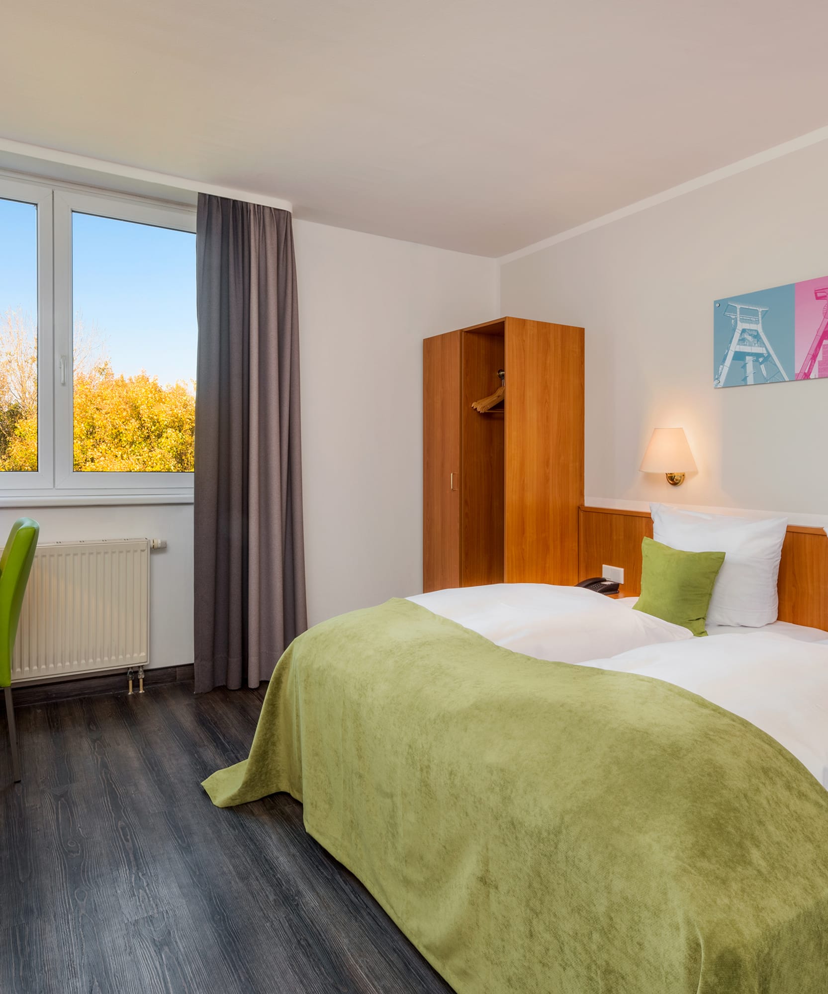 a room with a bed and a desk