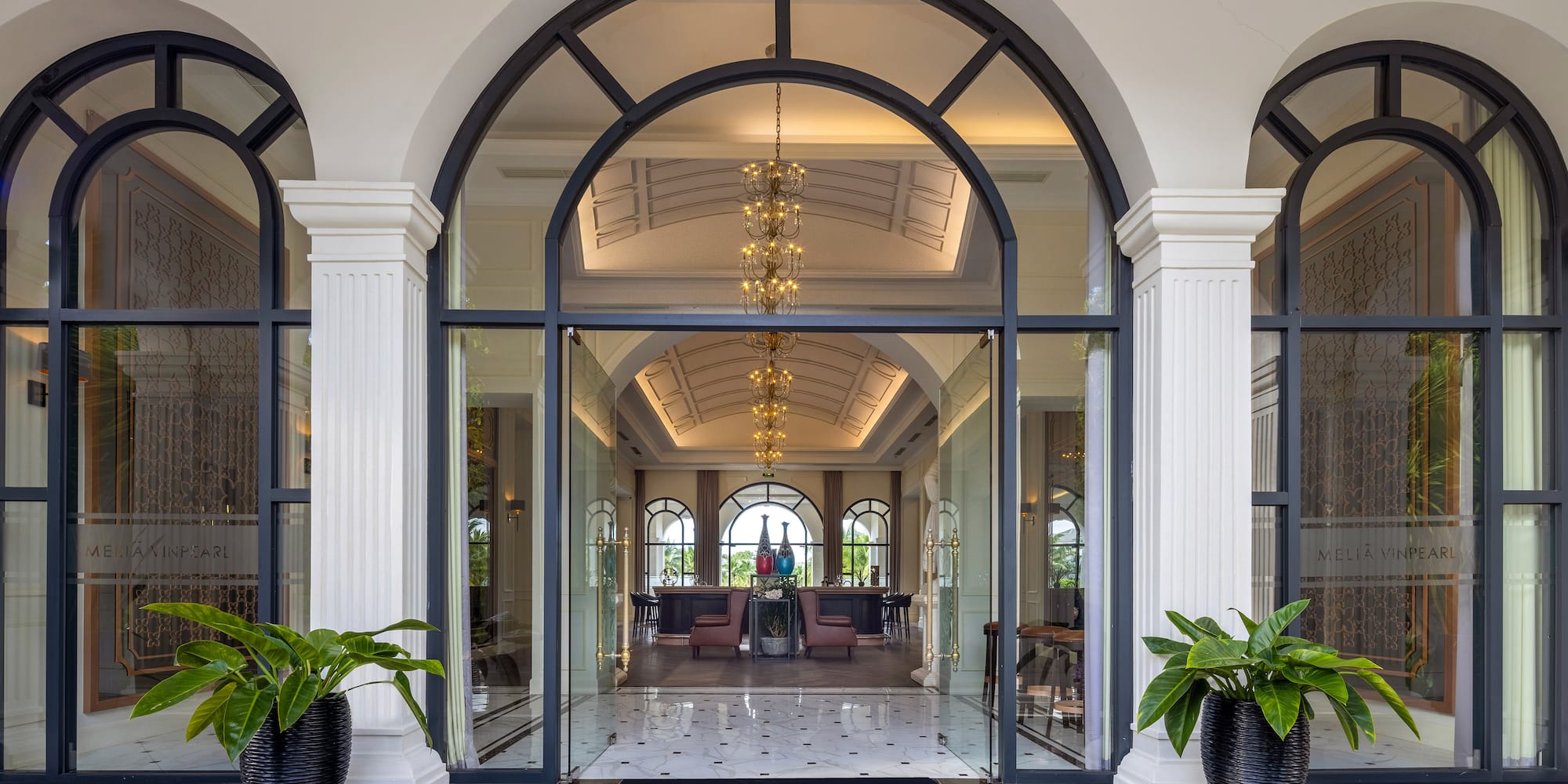a building with arched windows and a large doorway