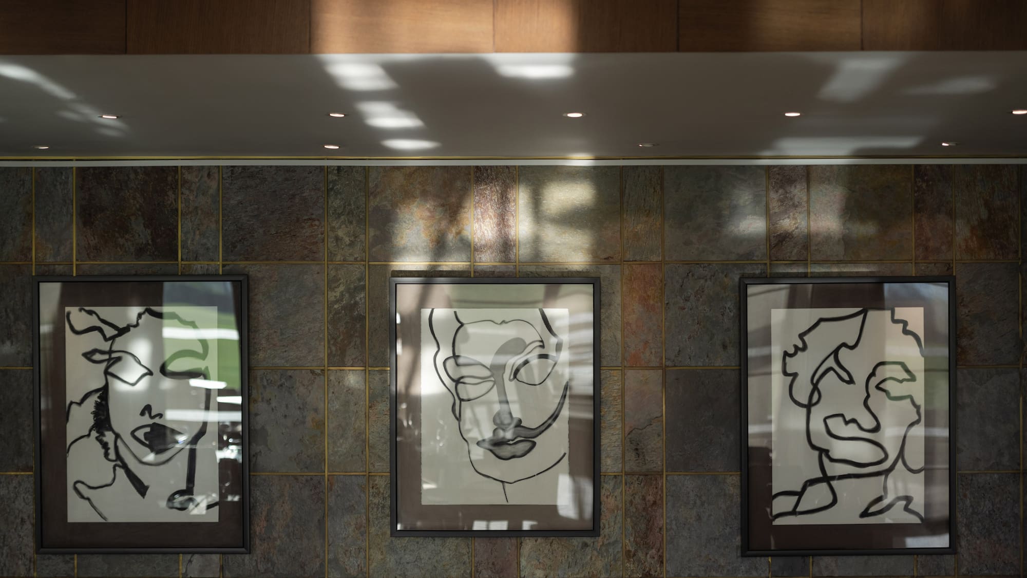 a group of framed pictures on a wall