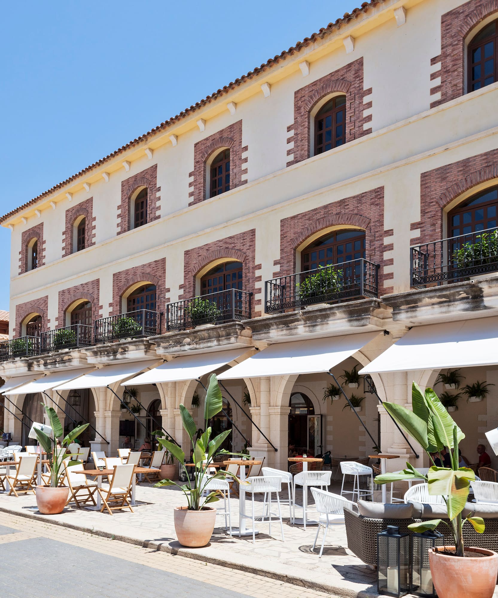 a building with tables and chairs outside