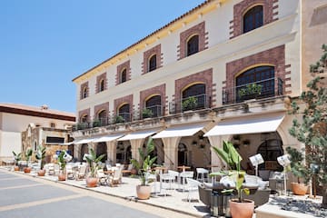 a building with tables and chairs outside