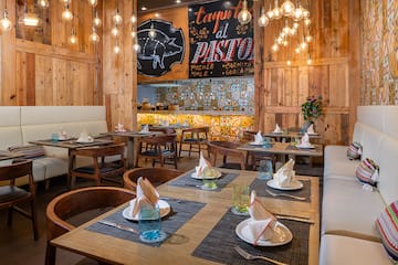 a restaurant with tables and chairs