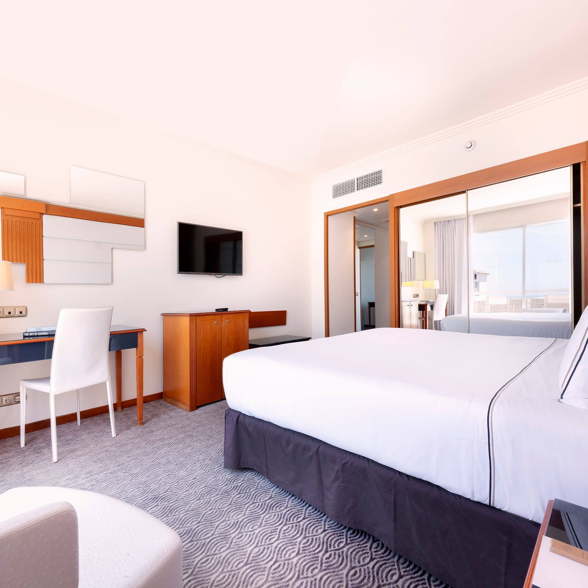 a room with a bed and a desk