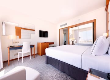 a room with a bed and a desk