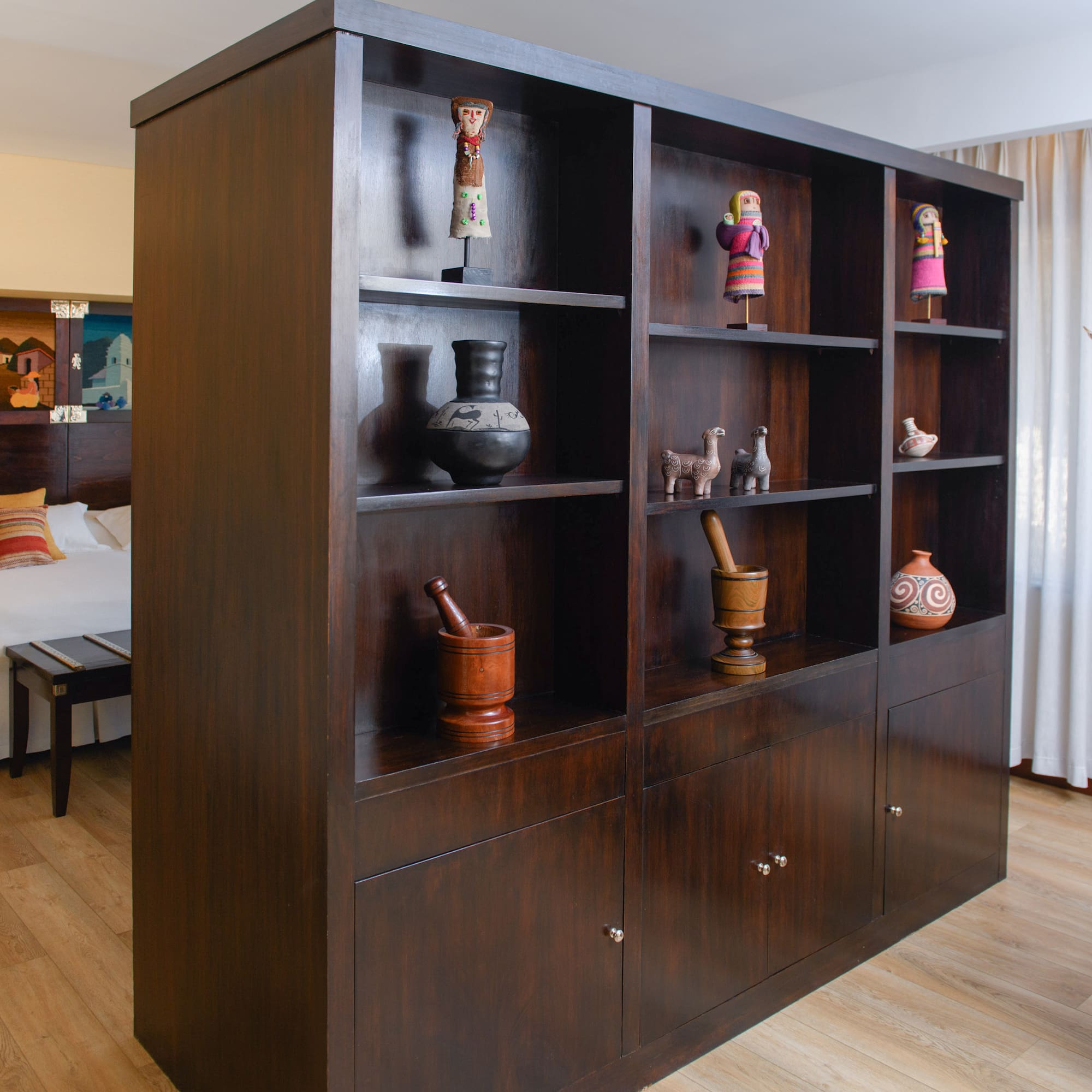 a large wooden shelf with objects on it